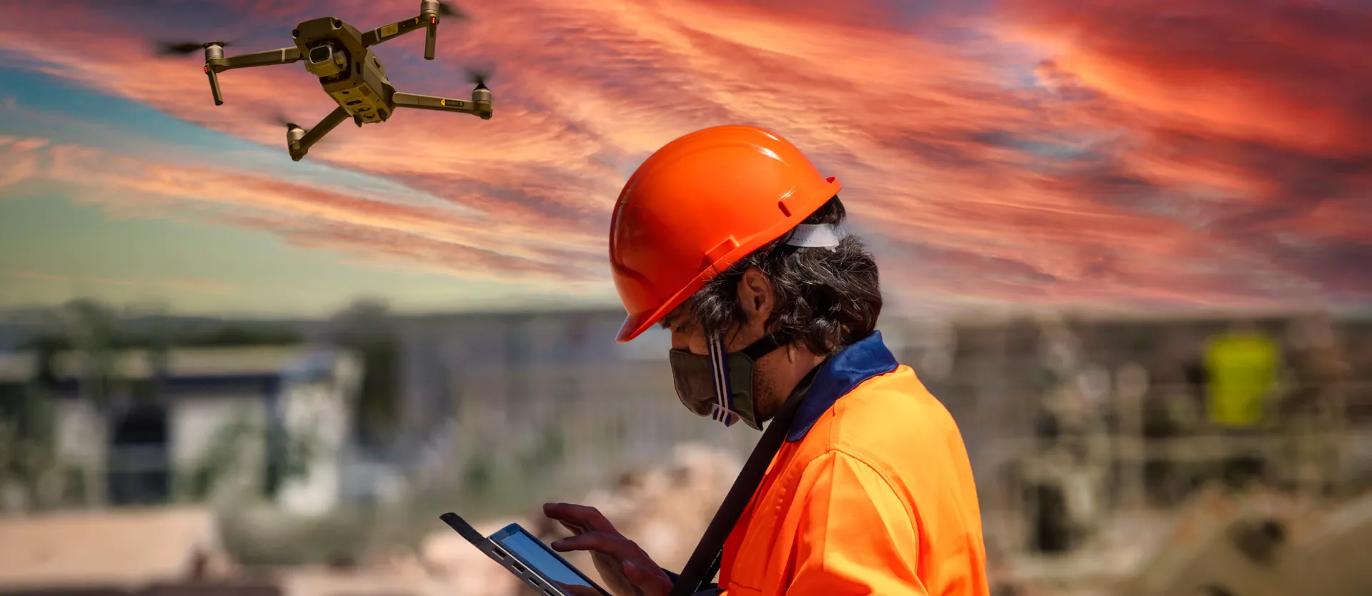 Drone operator carrying out a roof inspection
